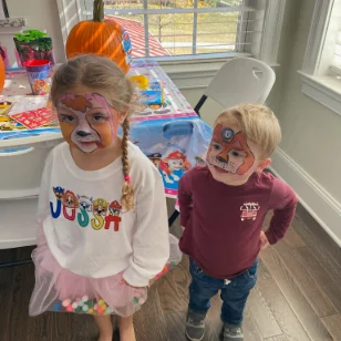 Two children with paw patrol facepaintings