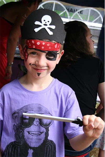 child's face painting of a pirate