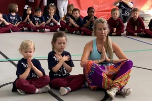 Image of a yoga instructor at a kid's birthday party